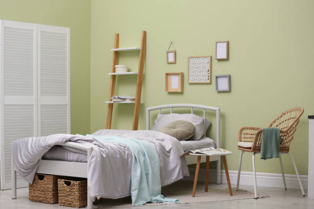 istock Bed with fresh linens in stylish room. Interior design 1324506255