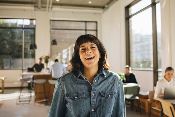 istock Smiling female freelancer in co-working space 1324509495
