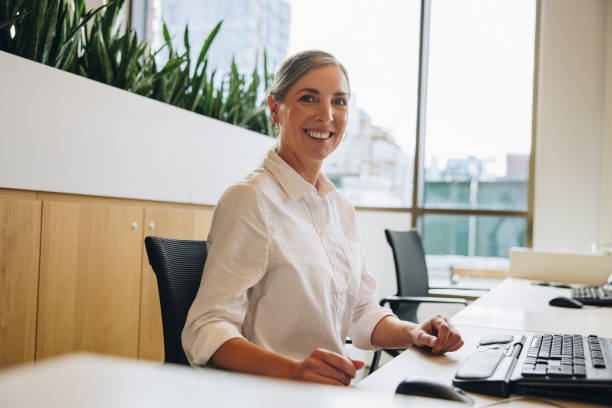 istock Cheerful businesswoman at work 1324509626