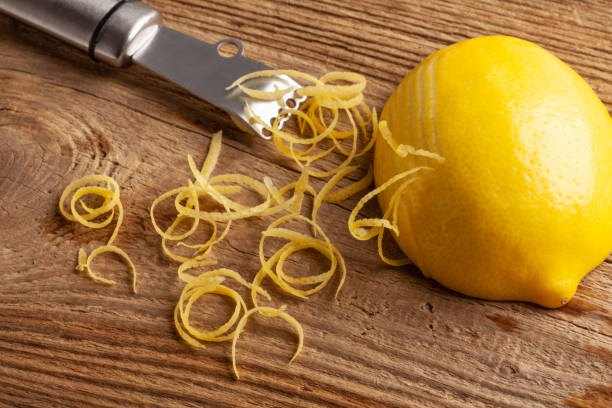 istock lemon zest and Zester on wooden board 1324510691