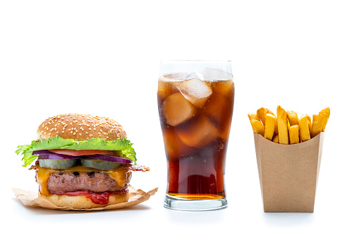 Burger combo with cheeseburger hamburger cola soda beverage glass and disposable french fries in kraft paper box isolated on white background