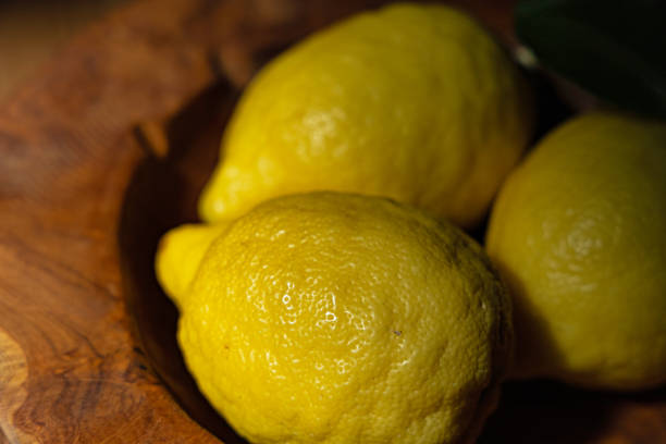 istock three amalfi lemons in a wooden bowl 1324512592