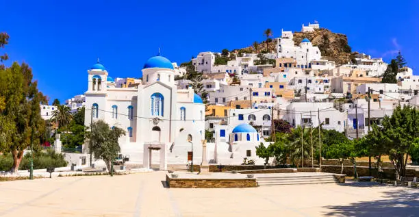 Photo of Beautiful  islands of Greece - Ios , Cyclades. Whitewashed traditional houses of picturesque village Chora, view of square and church in downtown