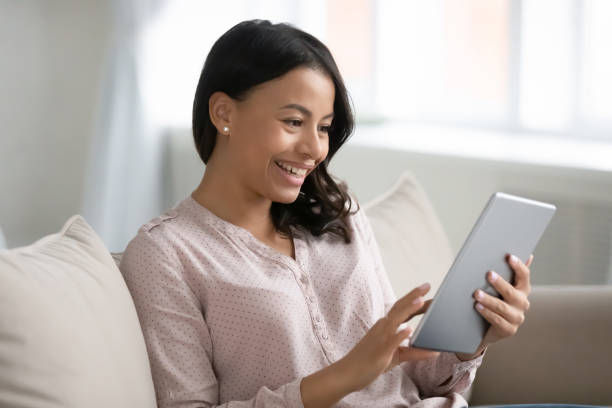 istock Happy mixed raced woman using tablet for video call 1324522215