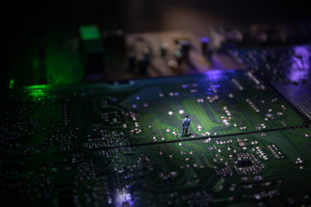 istock Stylized photo of an electronic microcircuit. Microcircuit, contacts, electronics, motherboard. Black background. Macro photography of electronic devices. 1324525141