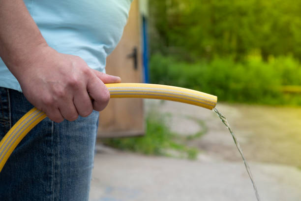 Prostatitis Prostatitis.Men's disease.A figurative image. A man with a water hose. prostate gland stock pictures, royalty-free photos & images