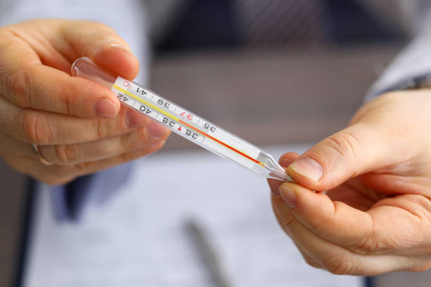 istock Male doctor holding in hand thermometer 1324526575