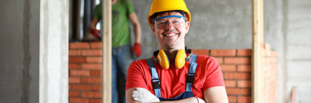 istock Happy handyman in uniform 1324527888