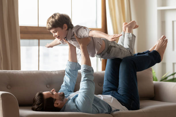 istock Playful young dad have fun with little son 1324531996