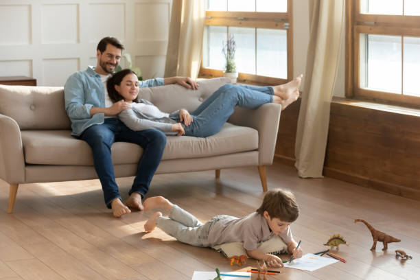 istock Happy family with kid relax at home 1324532004