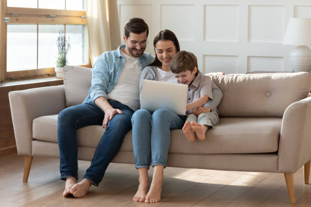 istock Happy family with little son use laptop 1324532007