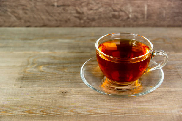 istock fresh tea in transparent glass cup 1324532938