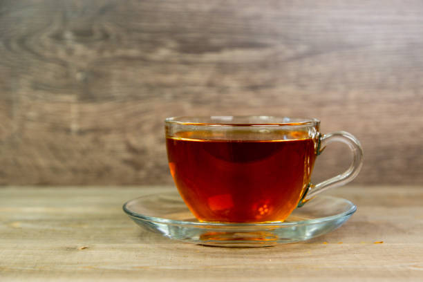 istock fresh tea in transparent glass cup, front view 1324532945
