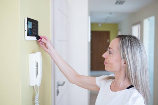 istock The woman disarms the security system at home. 1324534536