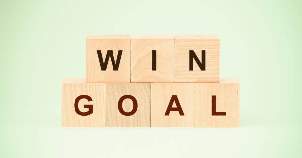 istock words win and goal with letters on small wooden blocks 1324534594