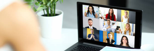 istock Woman talking with international colleagues using online video chat service 1324534706