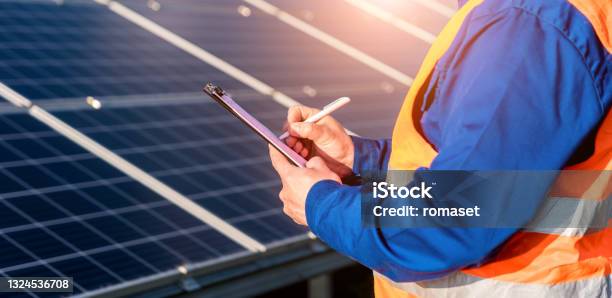 Inspector Examination Of Photovoltaic Modules Using A Thermal Imaging Camera Stock Photo - Download Image Now
