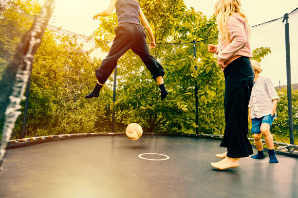 istock Children jumping on trampoline 1324536786