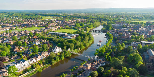Aerial view of River Dee in Chester including Queens Park Bridge and The Old Dee Bridge, Cheshire, England, UK Aerial view of River Dee in Chester at dusk including Queens Park Bridge and The Old Dee Bridge, Cheshire, England, UK chester england stock pictures, royalty-free photos & images