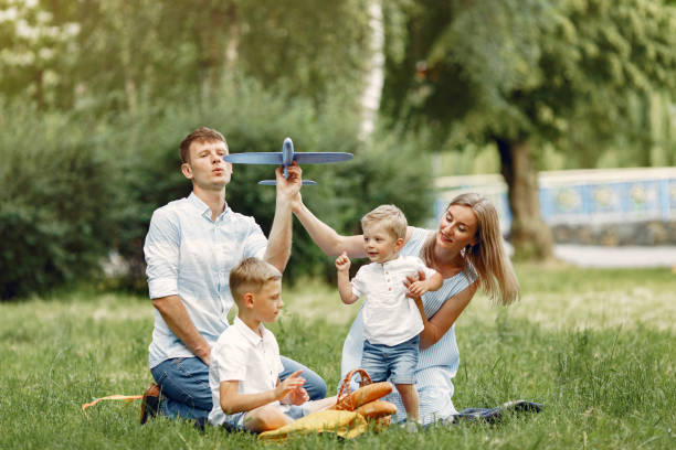 istock Cute family playing in a summer field 1324538996