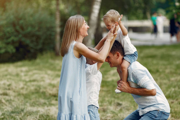istock Cute family playing in a summer field 1324539030