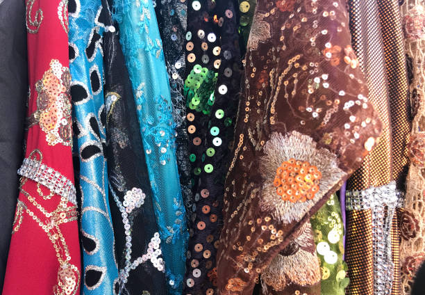 istock bright, sparkly colored dresses on the hanger 1324541372