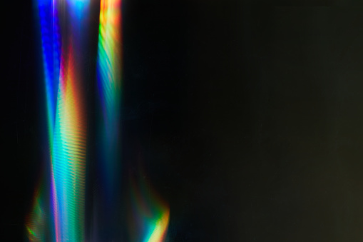 Blurred Rainbow Flare con efecto vintage en la película. Polvo y arañazos. Superposición Bokeh Luz Fugas Retro Reflexión. Fondo abstracto de brillo brillante borroso y destello colorido. photo