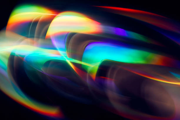 istock Blurred Light painting one exposure in camera. light glares with a spectral gradient on a dark background. Multicolored abstract colorful line. Unusual light effect. 1324542658