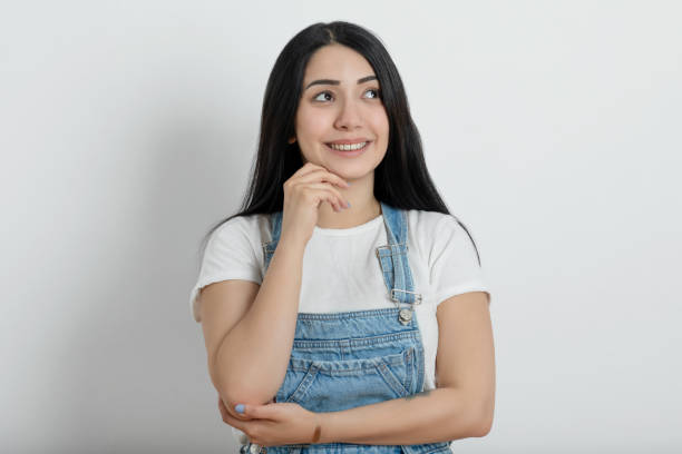 istock Young woman looking away 1324548035
