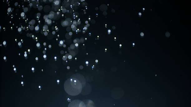istock Macro Close Up Downpur Bokeh Water Drops on Black Background 1324548372