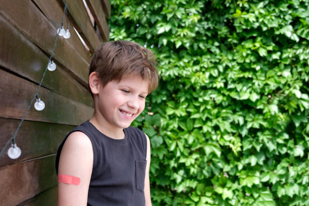 istock Boy vaccinated against coronavirus infection. Vaccination against covid-19. Sputnik-V. Copy space 1324549258