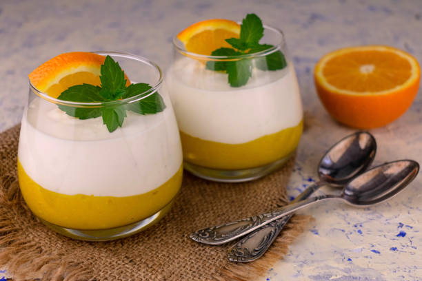 istock Two orange desserts with mascarpone cheese. 1324549272