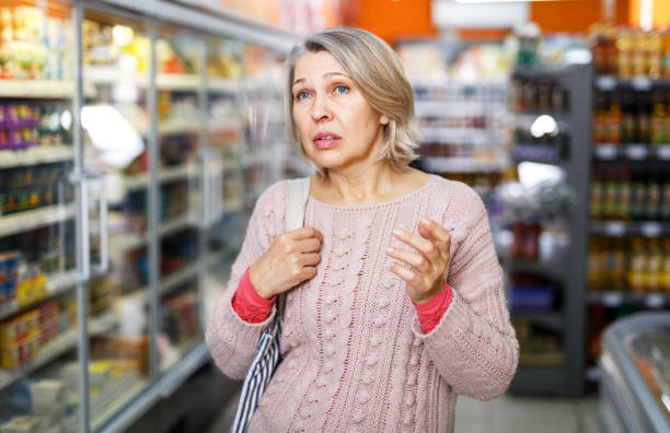 istock Pensive female shopping at store 1324552848