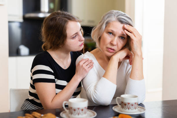 istock Daughter comforting upset mother 1324552980