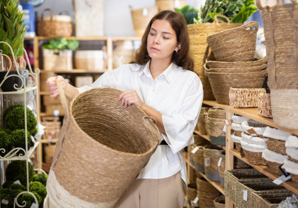 istock Woman choosing wicker basket at hardware store 1324554261