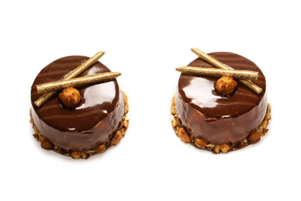 istock Chocolate and caramel cake isolated on a white background. 1324556145