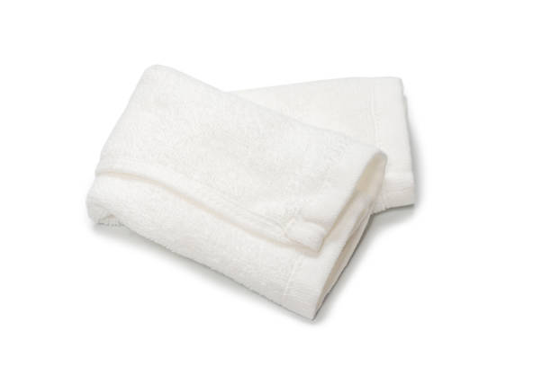 istock White fluffy cotton towel isolated on a white background. 1324556169