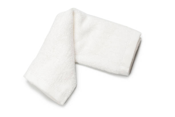 istock White fluffy cotton towel isolated on a white background. 1324556177