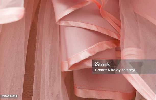 Premium Photo  Wrinkled, compressed pink tulle fabric on a white surface  close-up