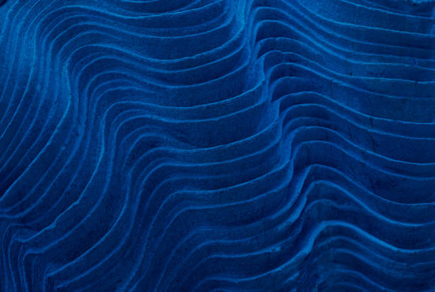 Abstract stone texture texture. Layers of petrified limestone deposits. Classic blue tinted