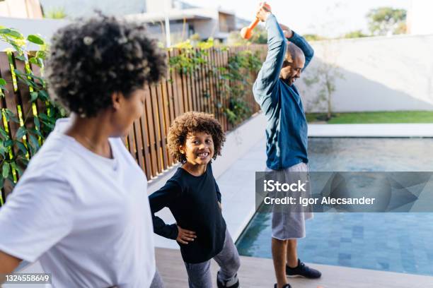 Family exercising in the backyard