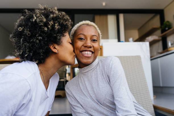 istock Mother kissing her daughter 1324558760