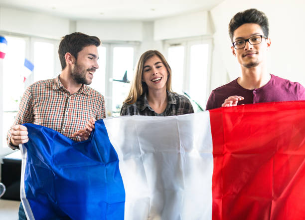 istock group of french supporter on the sofa 1324558786