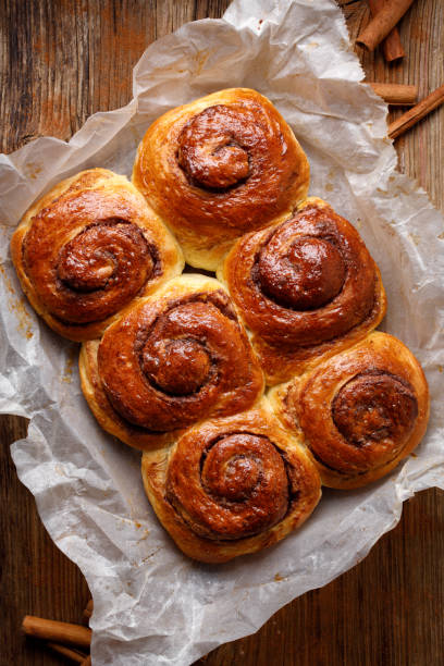 istock Homemade cinnamon rolls in spiral shape,  top view 1324559676