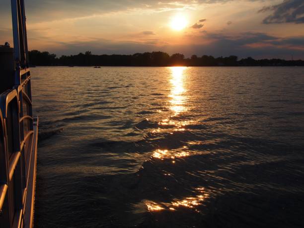 istock Lake Sunset Reflecting on Pontoon Boat 1324559904