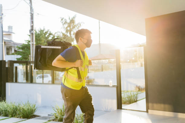 istock delivery man arriving at the house 1324559980