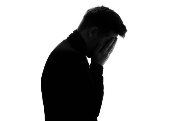istock Silhouette of man crying being sad having depression 1324561133