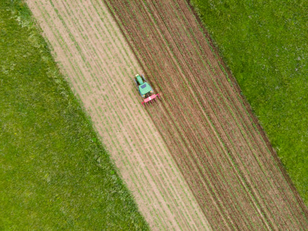 istock High Angle View on Tractor Working on Agricultural Field 1324564407