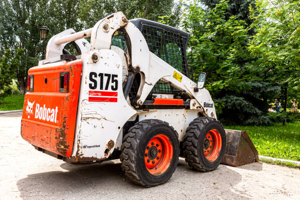 bobcat loader vehicle at the city street - editorial land vehicle construction equipment built structure imagens e fotografias de stock