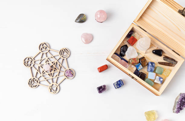 istock Healing chakra crystal grid therapy. Rituals with gemstones and aromatherapy for wellness, healing, meditation 1324566081